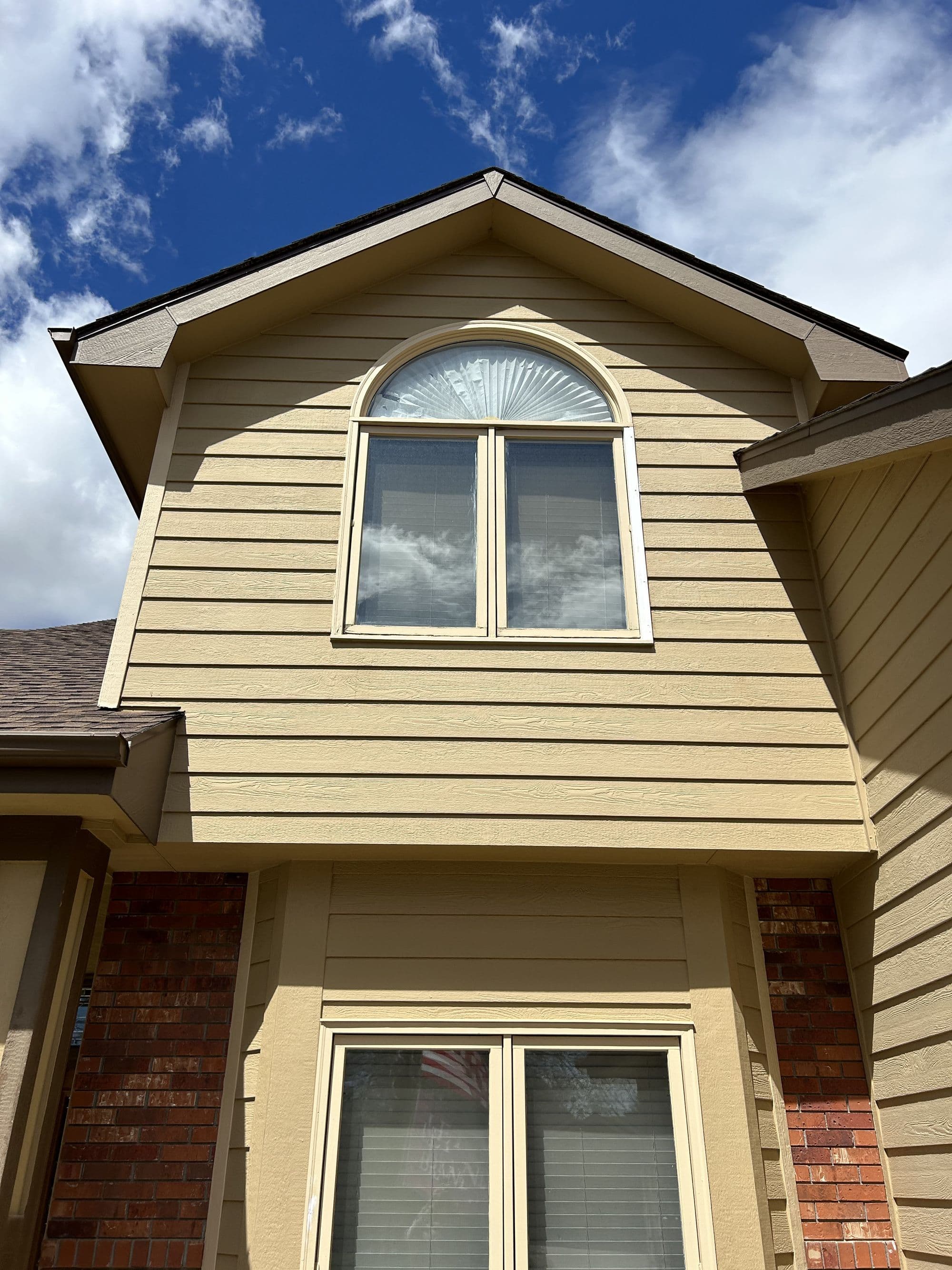 New siding on a home's upper dormer window