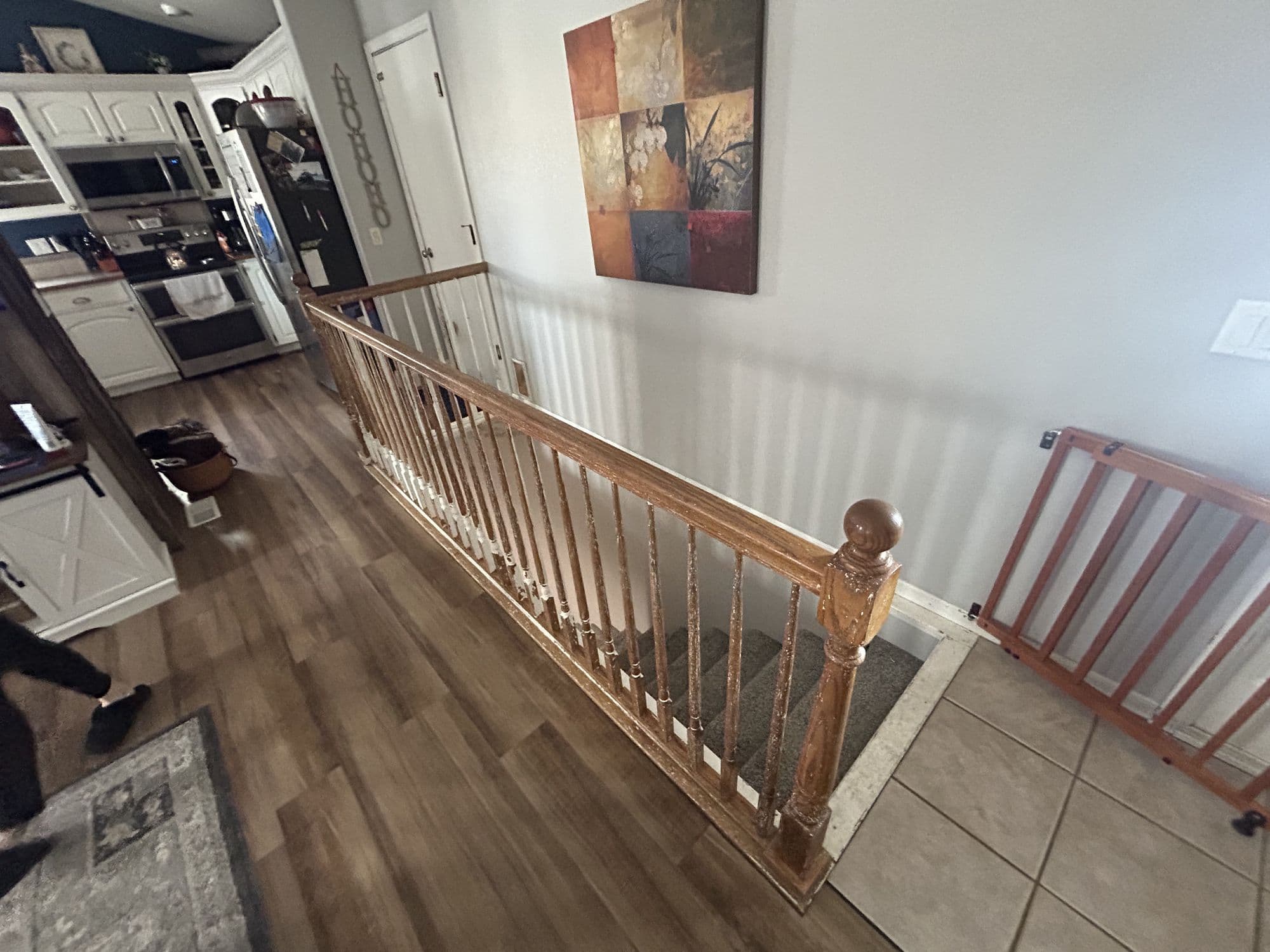 Custom wood handrail along an interior stairway