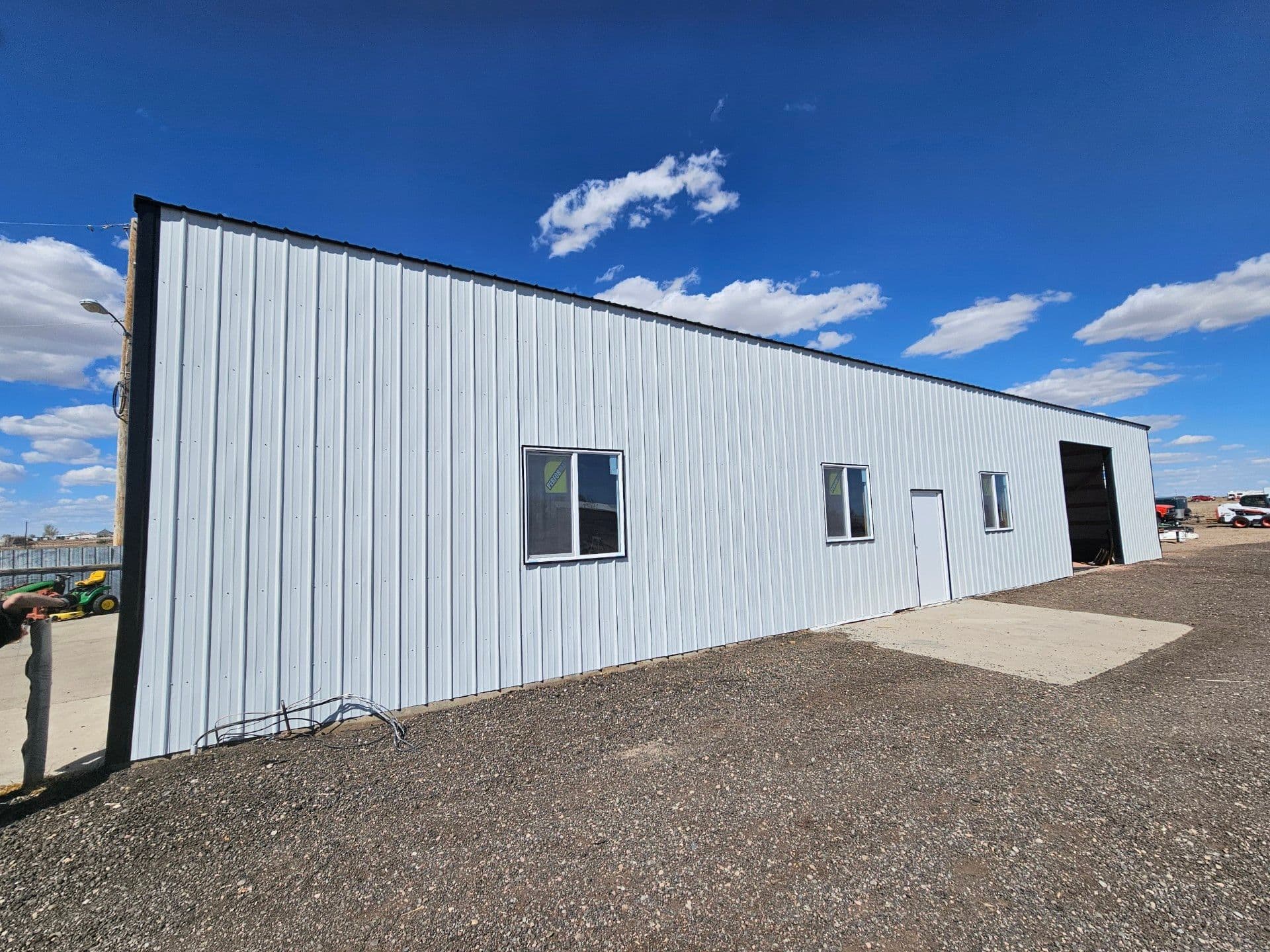 Completed pole barn with window and man door, Eaton, Colorado