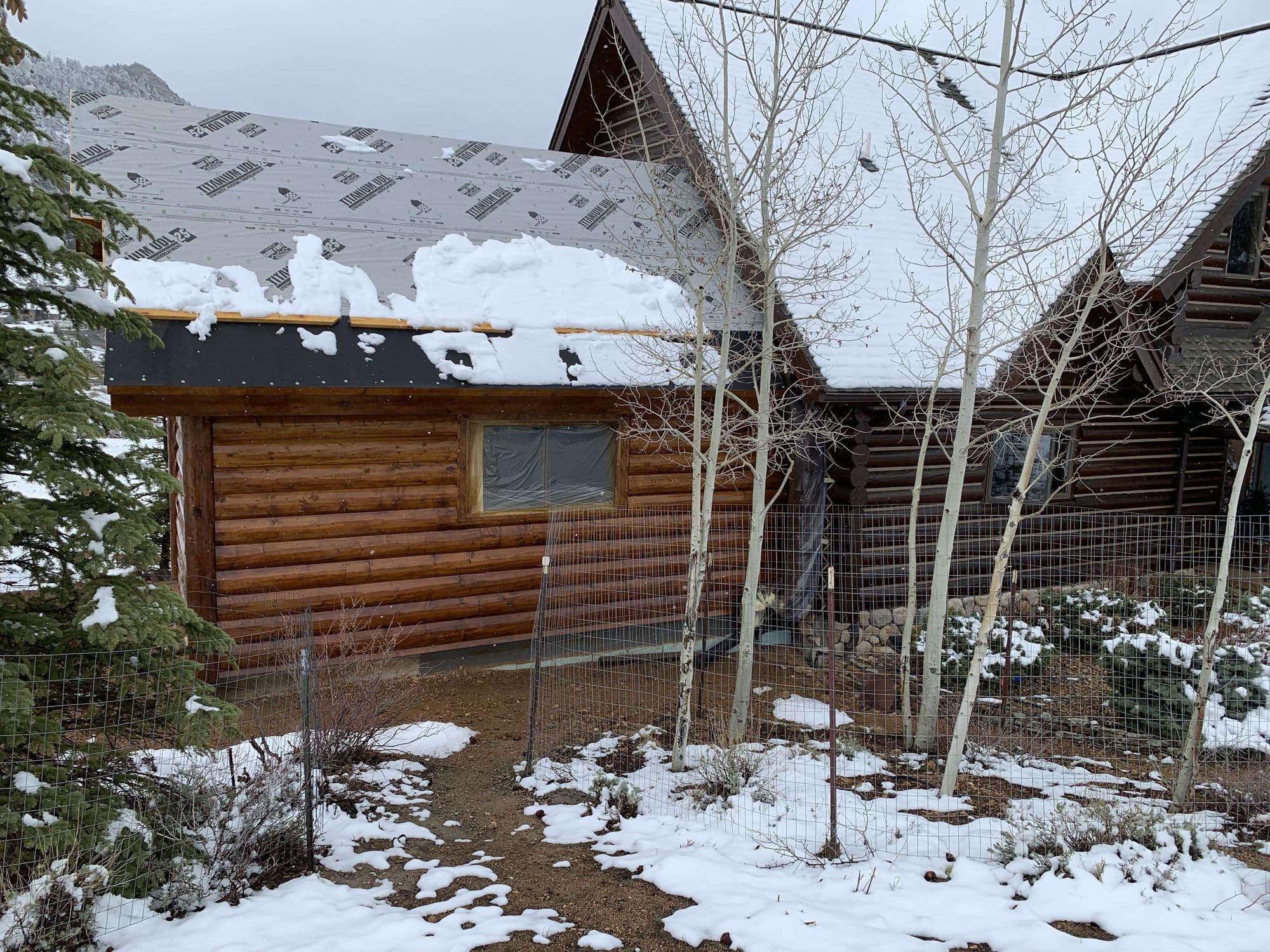 Finished log home addition exterior in Estes Park, Colorado