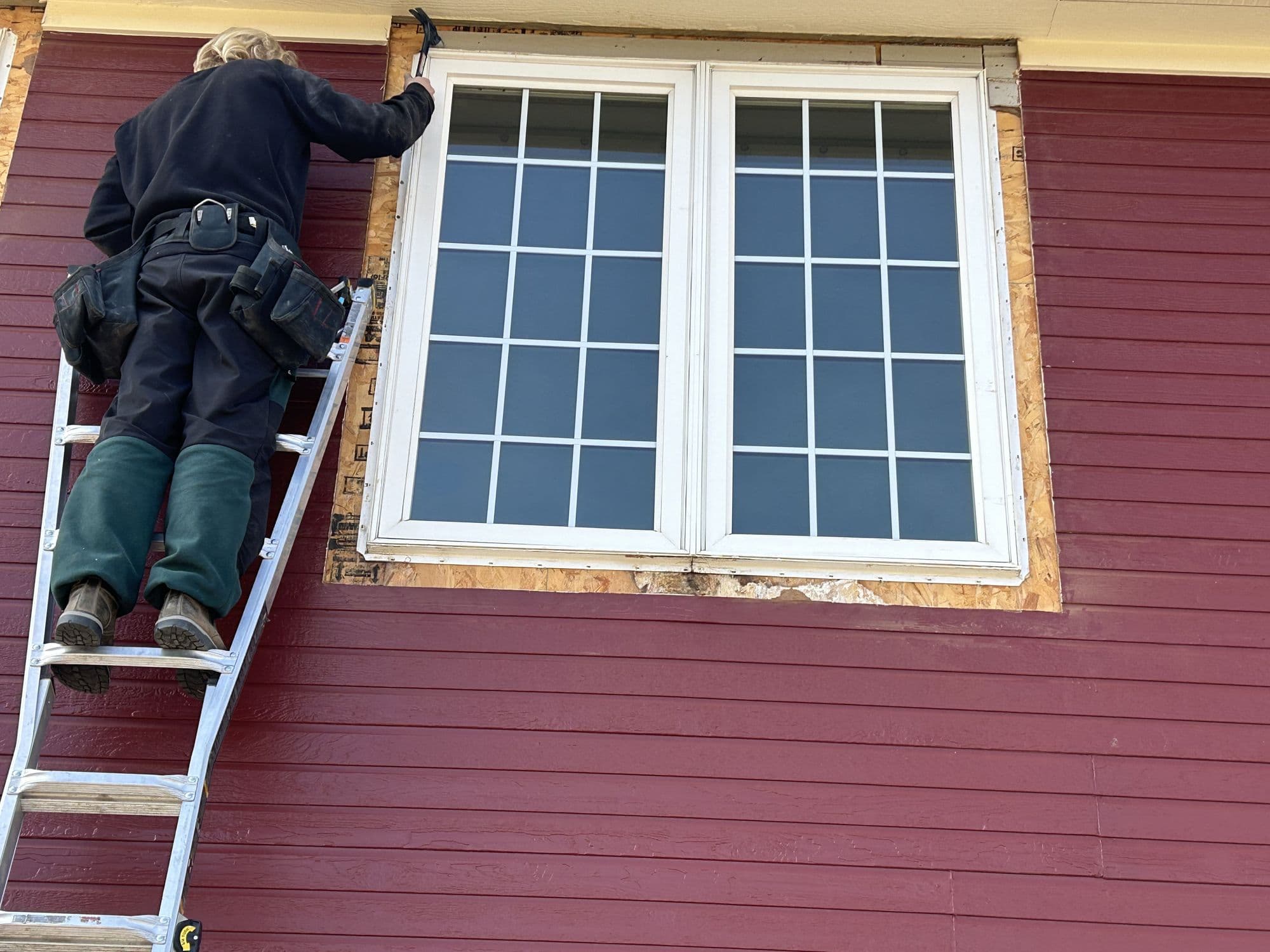 Installing a new window on a home exterior