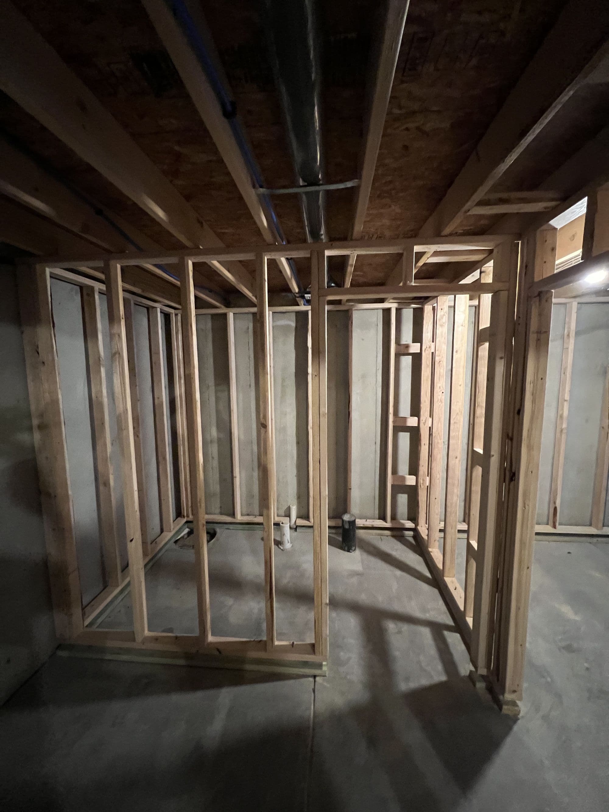 Basement framing in progress during a finish-out project