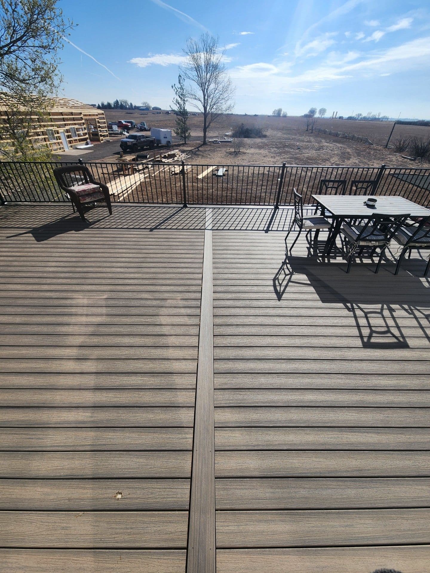 Finished composite deck with outdoor furniture