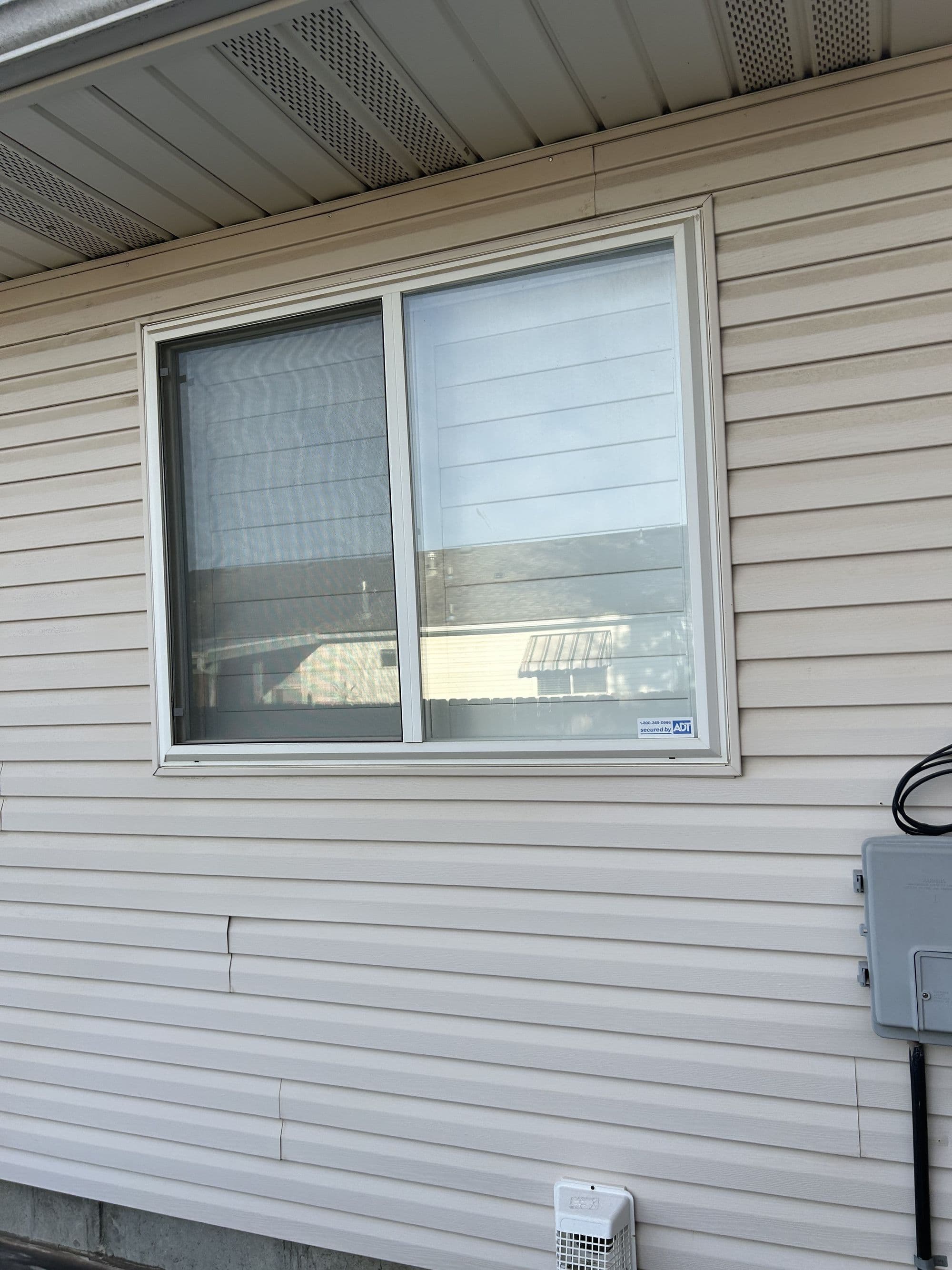 Home exterior before a deck and door addition