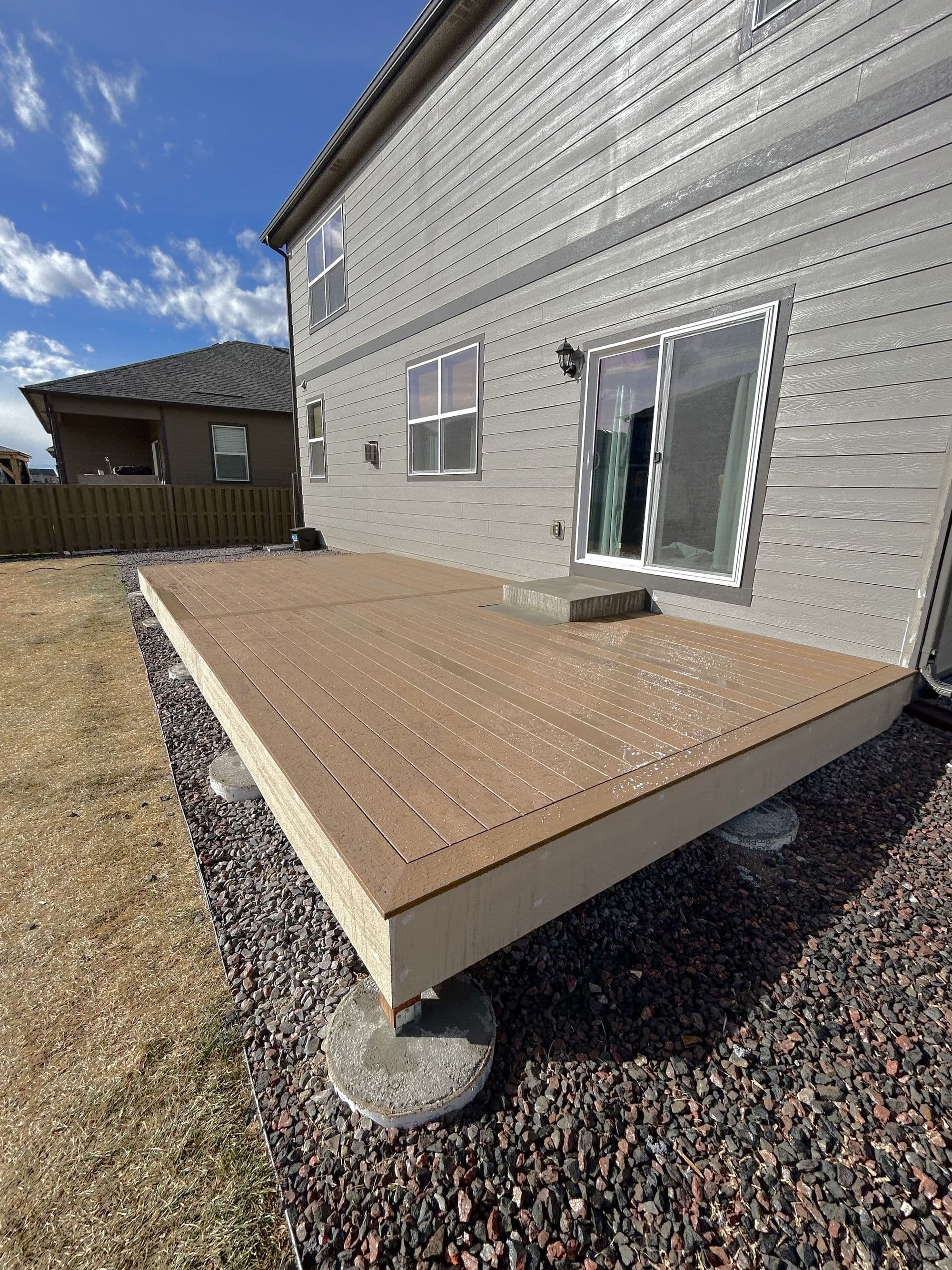 Finished deck with outdoor furniture and hot tub, Johnstown, Colorado