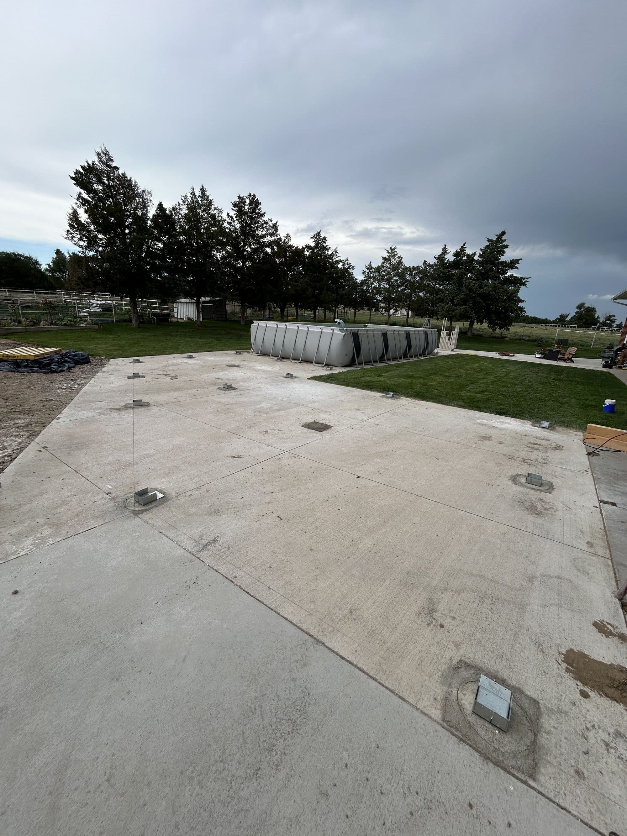 Footings and ledger board set for a new pool deck