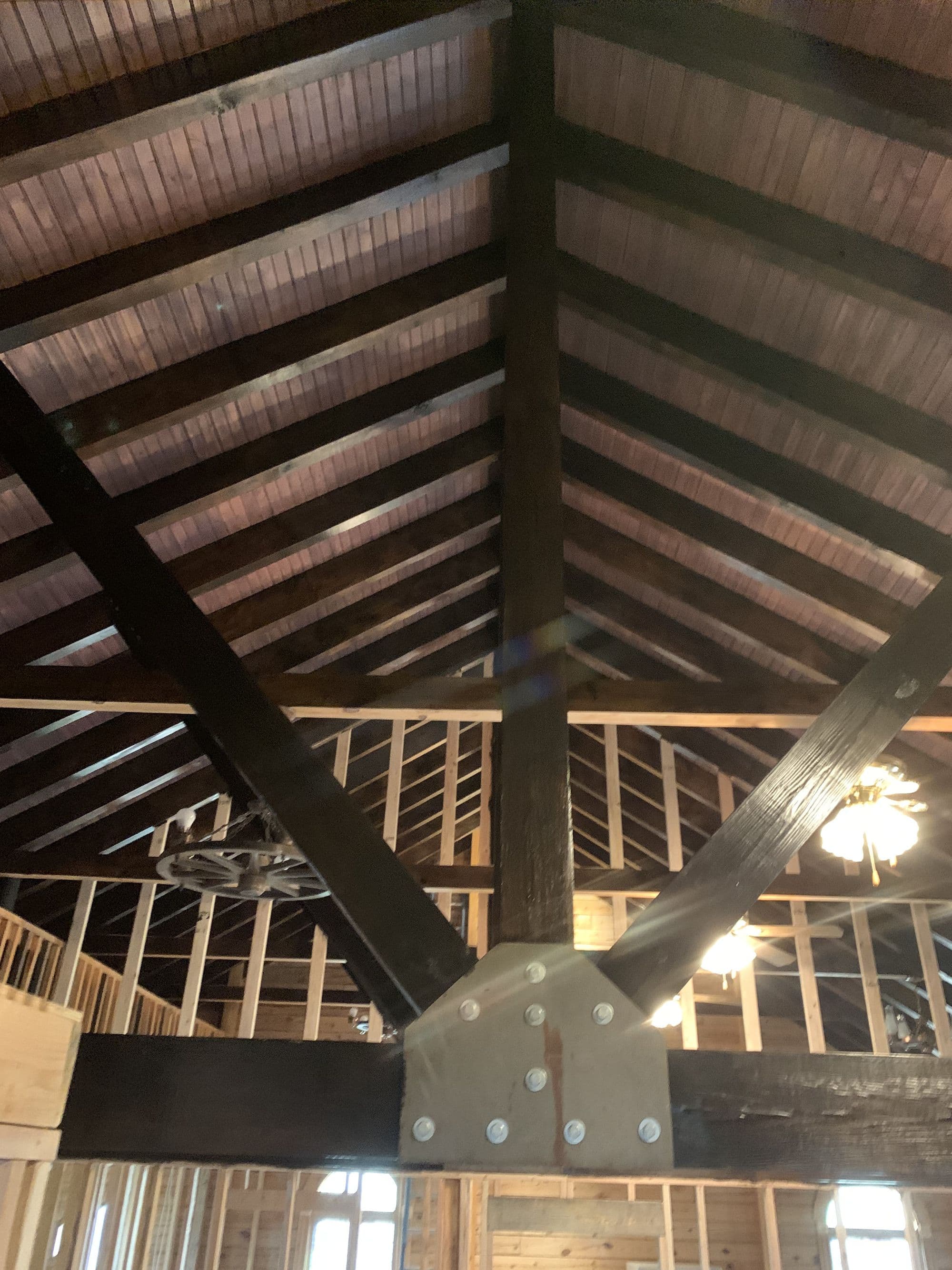 Exposed timber truss framing during a remodel